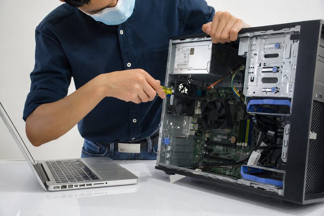 Fusion Tech USA technician repairing a desktop computer on-site